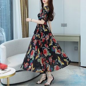 Mid length floral patterned dress. New with tags.